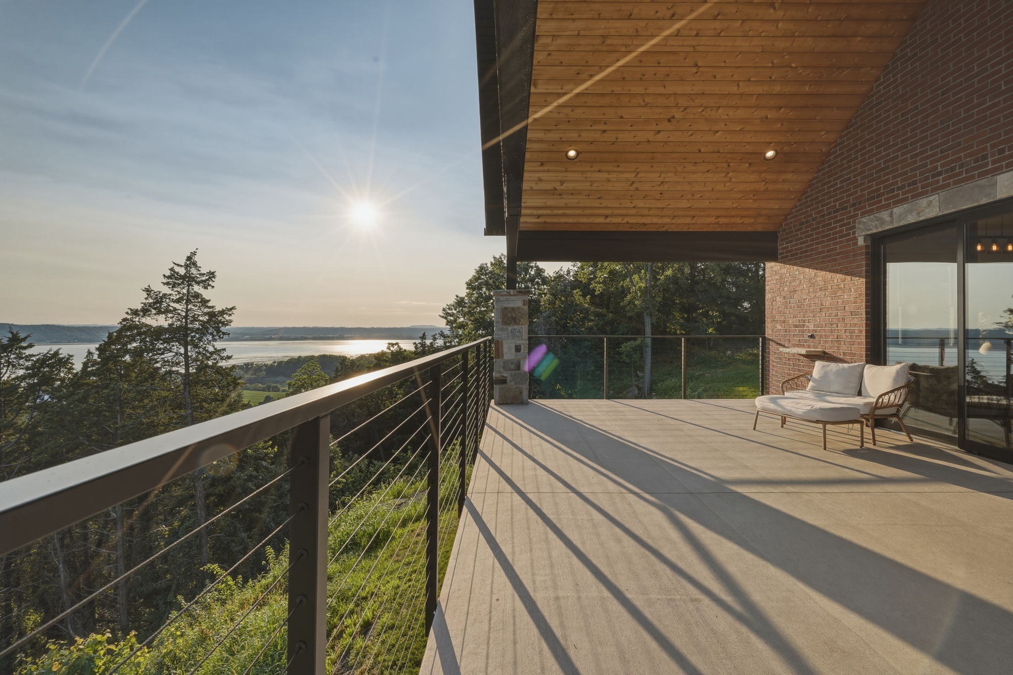 Open shelving and dining area with valley view through the windows behind